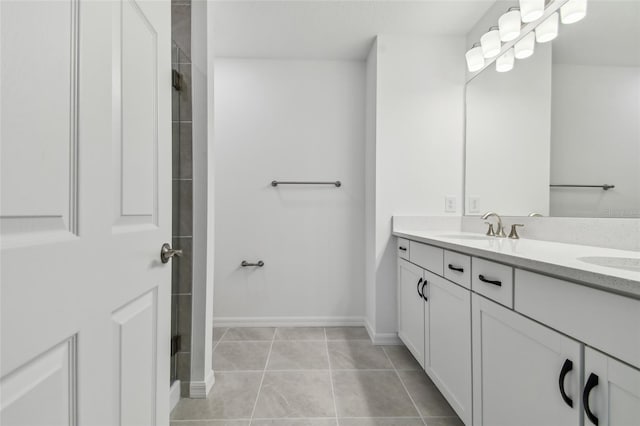 bathroom with tile patterned floors and vanity