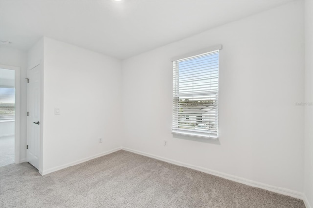 empty room with light colored carpet