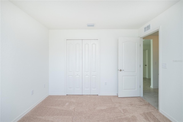 2203 Carson Loop, Lake Wales, FL 33859 - unfurnished bedroom featuring visible vents, carpet, and a closet