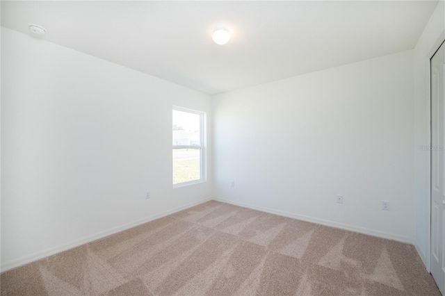 2203 Carson Loop, Lake Wales, FL 33859 - empty room with baseboards and light colored carpet