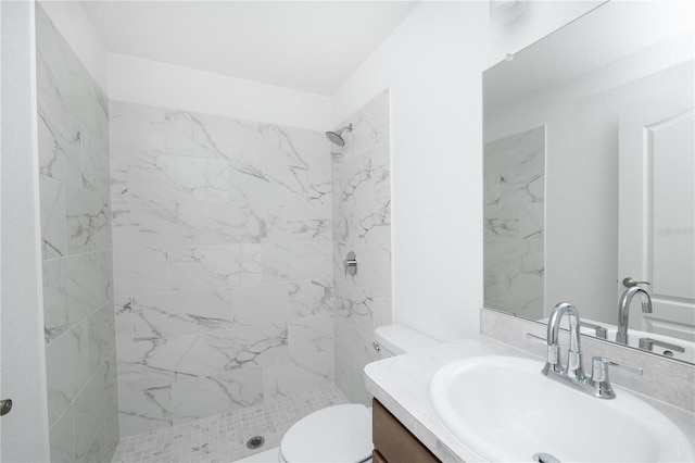 2203 Carson Loop, Lake Wales, FL 33859 - bathroom featuring a tile shower, toilet, and vanity