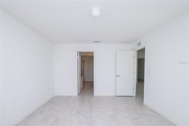 2203 Carson Loop, Lake Wales, FL 33859 - unfurnished bedroom with a spacious closet, baseboards, and visible vents