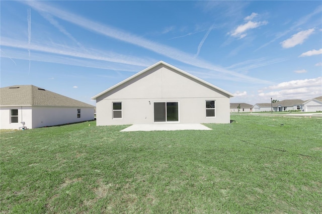 2203 Carson Loop, Lake Wales, FL 33859 - rear view of house with a lawn and a patio