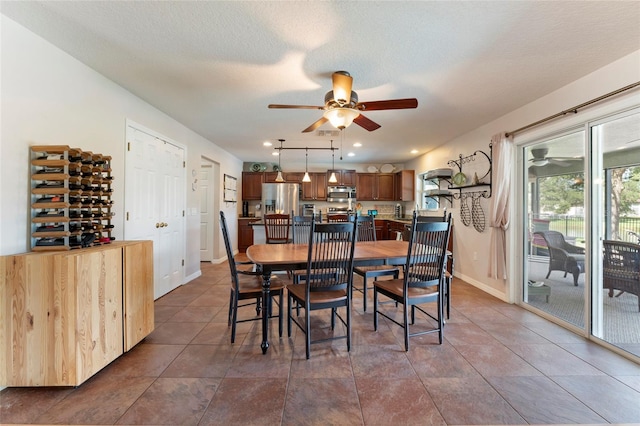 dining room featuring a textured ceiling