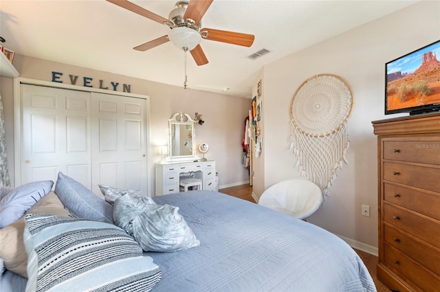 bedroom with hardwood / wood-style floors, a closet, and ceiling fan