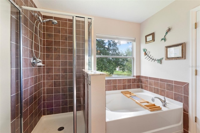 bathroom with shower with separate bathtub