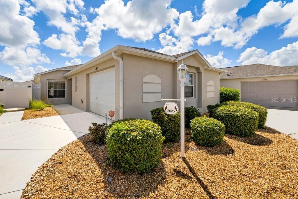 ranch-style home featuring a garage