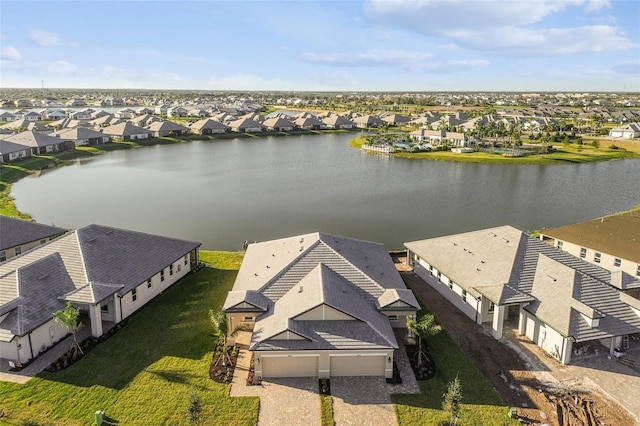 birds eye view of property with a water view