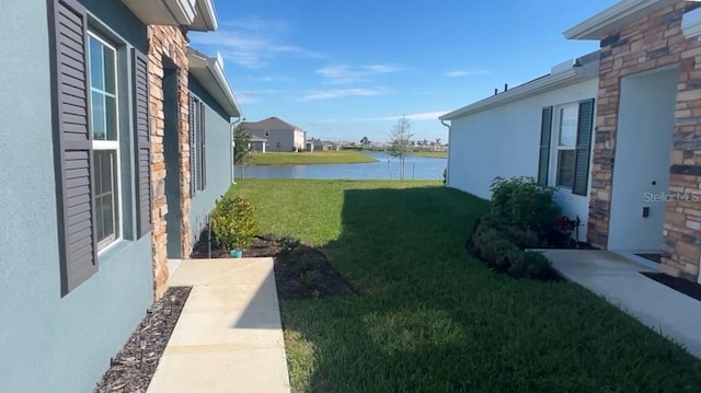 view of yard with a water view