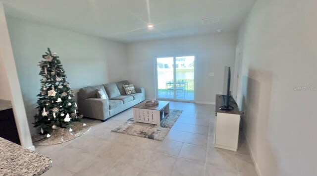 living room with light tile patterned floors