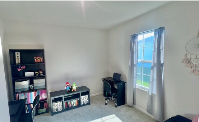 carpeted office featuring plenty of natural light