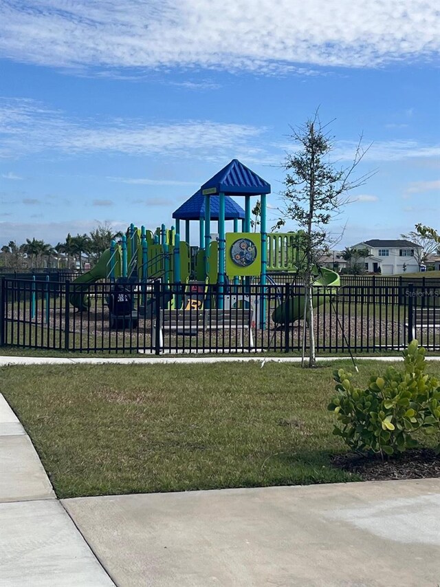 view of playground featuring a lawn