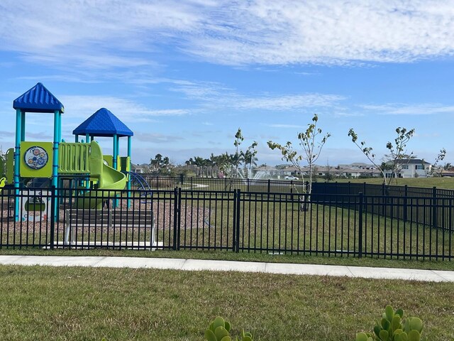 view of playground with a yard