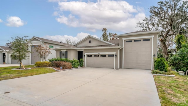 view of front of house with a garage and a front lawn