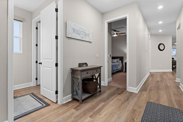 hallway with light wood-type flooring