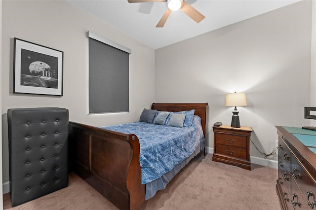 bedroom featuring light colored carpet and ceiling fan