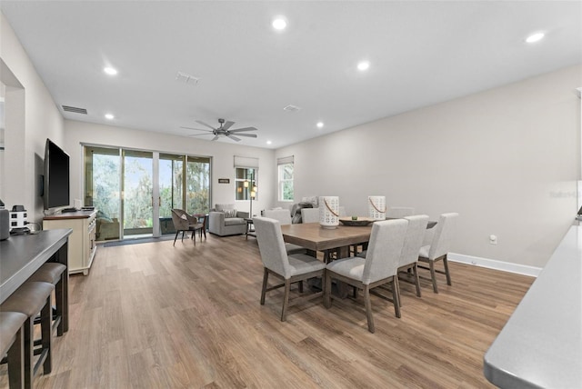 dining space featuring ceiling fan and light hardwood / wood-style flooring