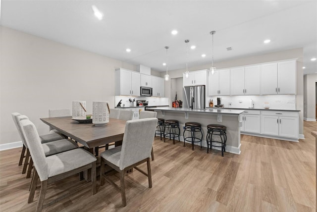 dining area featuring light hardwood / wood-style floors