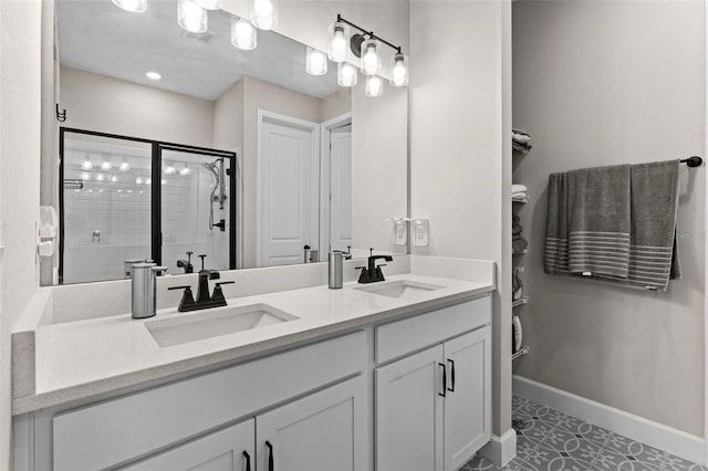 bathroom featuring tile patterned flooring, vanity, and a shower with shower door