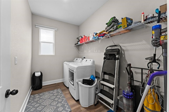 washroom with separate washer and dryer and dark wood-type flooring