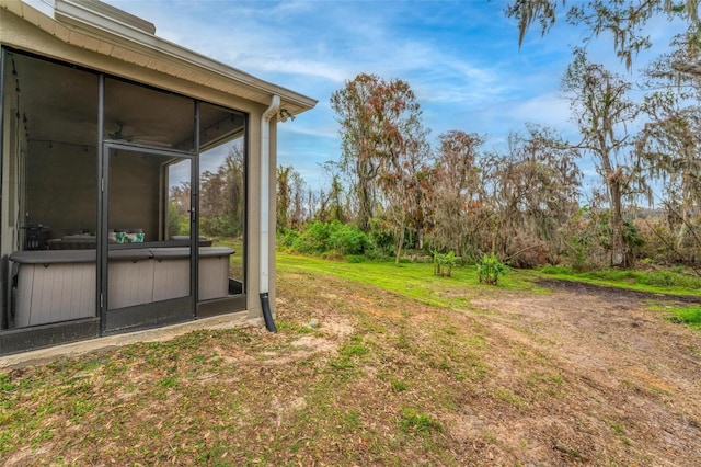 view of yard with a sunroom