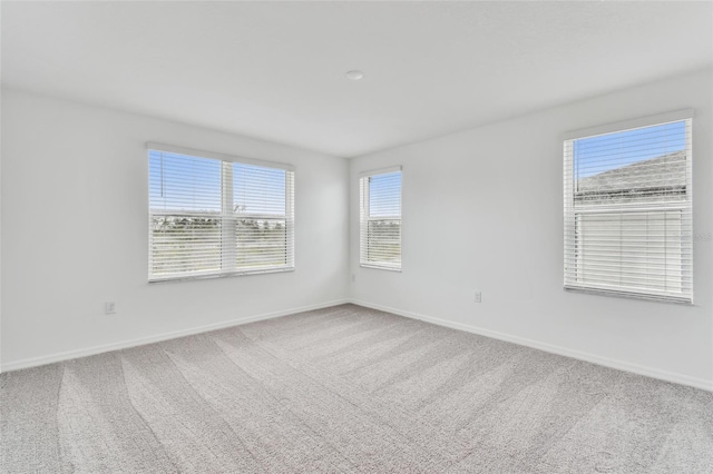 unfurnished room featuring carpet floors