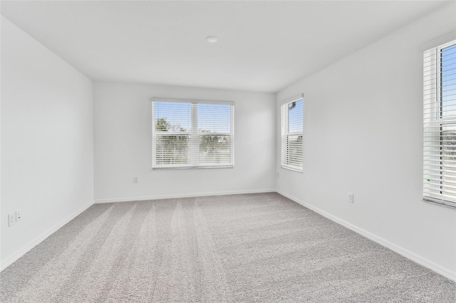 unfurnished room featuring carpet flooring