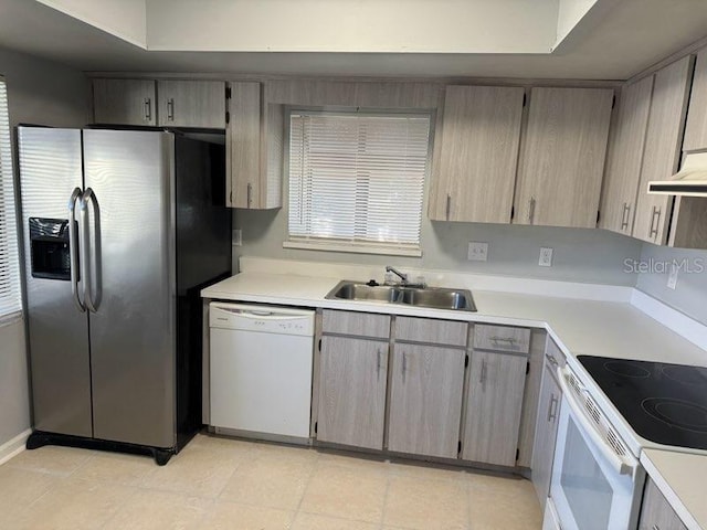 kitchen with sink and white appliances