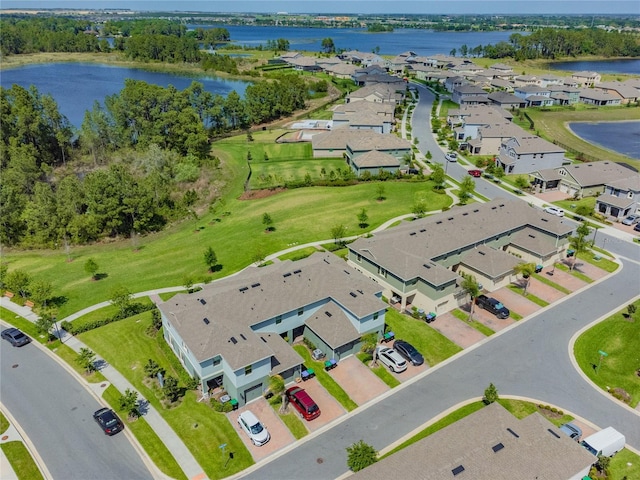 birds eye view of property with a water view