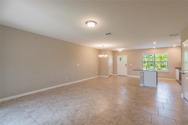 interior space with sink and a chandelier