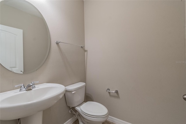 bathroom with sink and toilet