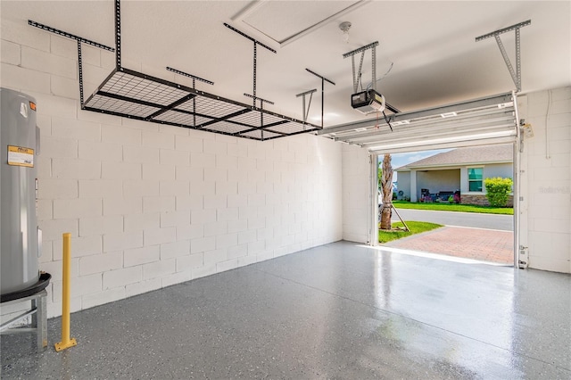 garage featuring water heater and a garage door opener