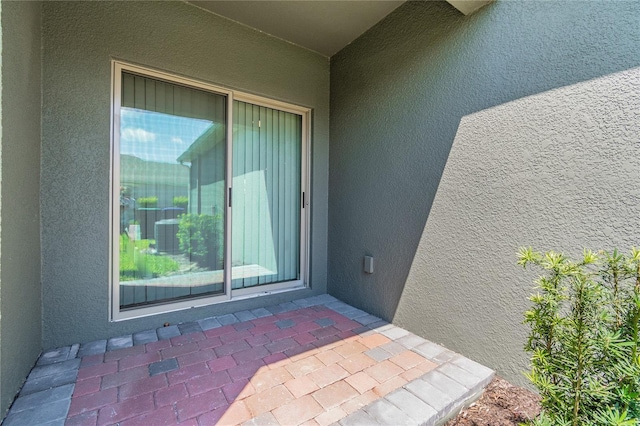 property entrance with a patio area