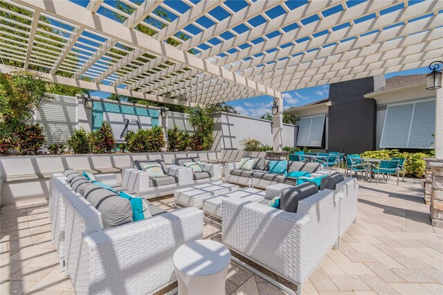 view of patio featuring an outdoor living space and a pergola