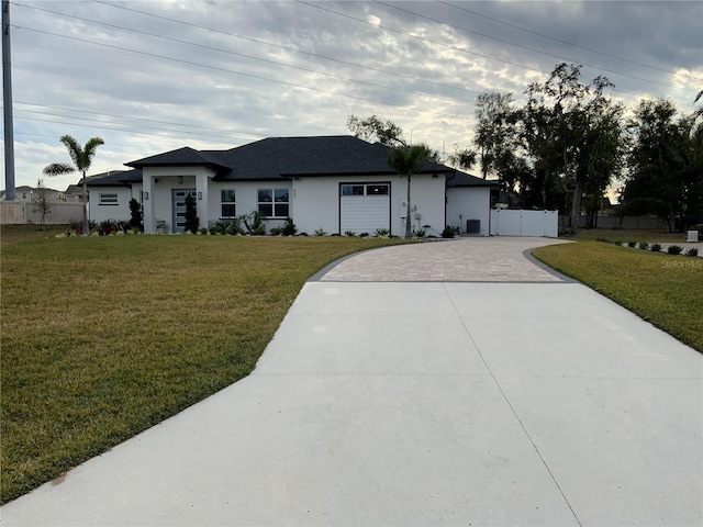 single story home featuring a front yard