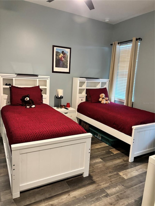 bedroom featuring ceiling fan and dark hardwood / wood-style floors