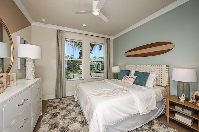 bedroom featuring baseboards, ornamental molding, and a ceiling fan