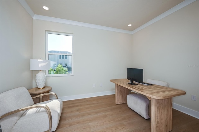 office space with light wood-style flooring, baseboards, crown molding, and recessed lighting