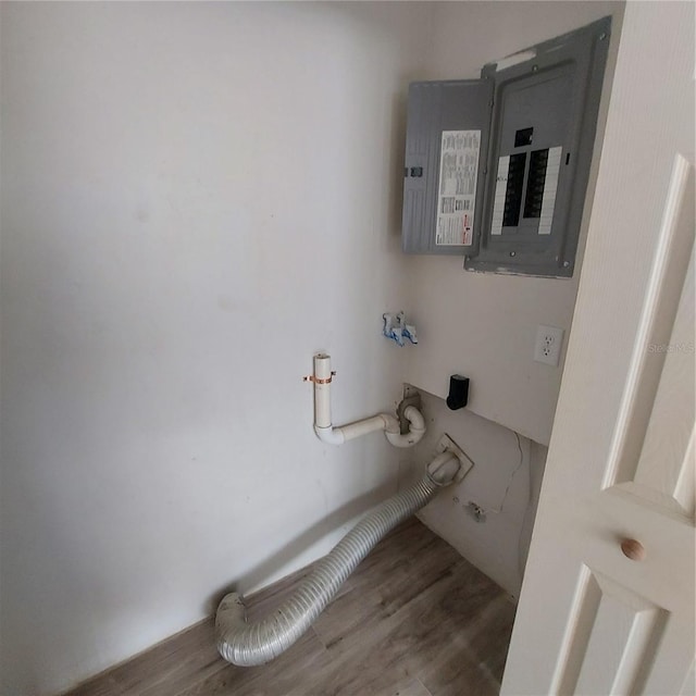 interior space featuring electric panel and wood-type flooring