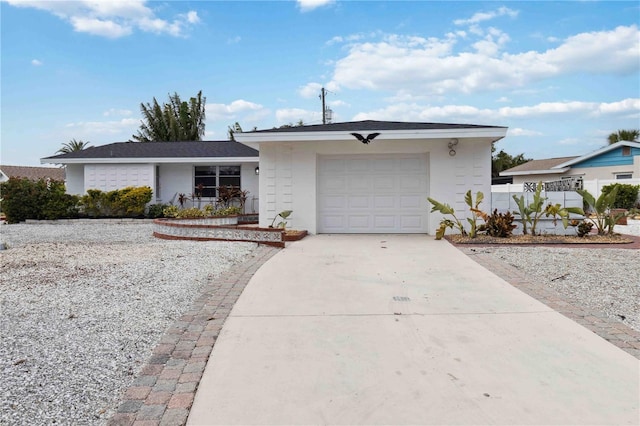 ranch-style house featuring a garage