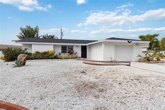 ranch-style home with a garage