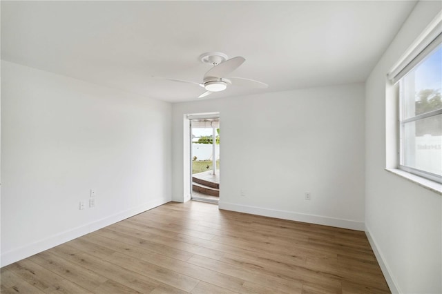 spare room featuring ceiling fan and light wood-type flooring