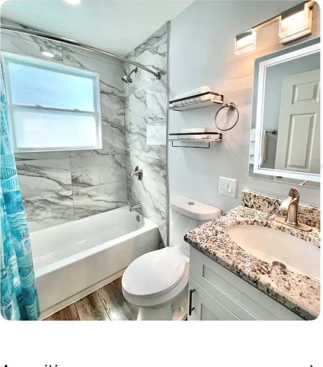 full bathroom with toilet, vanity, shower / bath combination with curtain, and hardwood / wood-style floors