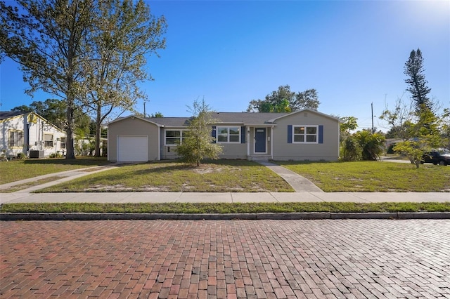 ranch-style house with a front yard and a garage