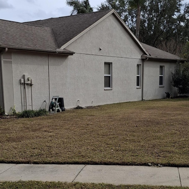 view of home's exterior with a lawn