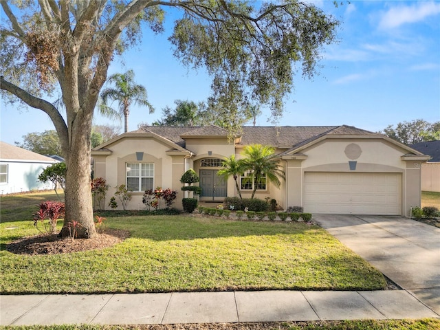 view of front of property featuring a garage and a front yard