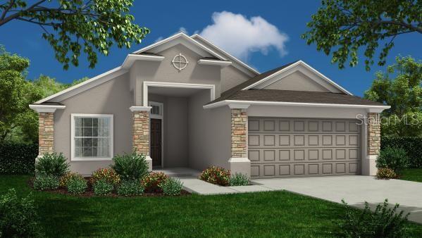 view of front facade featuring a front yard and a garage