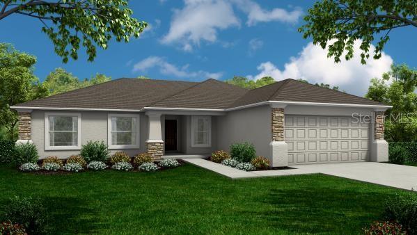 view of front of home featuring a garage and a front yard