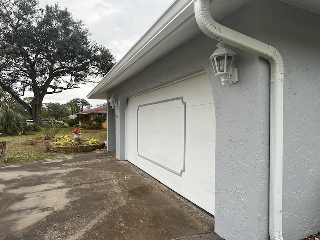 view of side of home featuring a garage