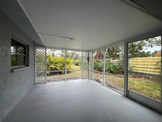 unfurnished sunroom with plenty of natural light